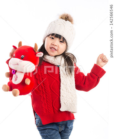 Smiling little girl hugging a red ox plush toy, celebrating the Year of the Ox, Chinese New Year theme.The Chinese character embroidered above: "Fu" (Good Fortune) Smiling little girl hugging a red ox plush toy, celebrating the Year of the Ox, Chinese New Year theme.The Chinese character embroidered above: "Fu" (Good Fortune) 142566546