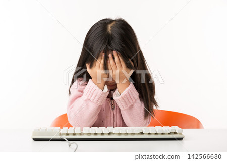 Tired Asian Little Girl Feeling Exhausted While Using Computer 142566680