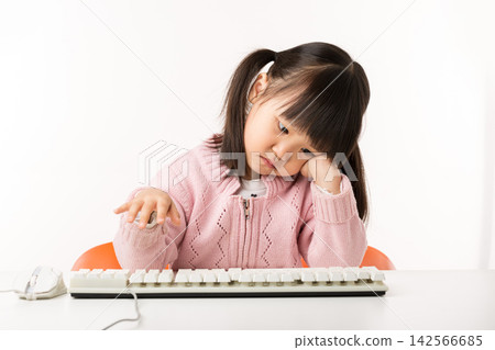 Tired Asian Little Girl Feeling Exhausted While Using Computer Tired Asian Little Girl Feeling Exhausted While Using Computer 142566685
