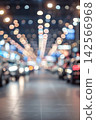 Abstract bokeh lights with blurred vehicles in an indoor hall setting 142566968