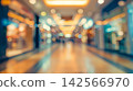 Blurred bokeh lights in a modern indoor shopping corridor 142566970