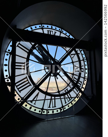 Iconic giant clock inside Musee d Orsay in Paris with Roman numerals and a view of the city through the transparent clock face Iconic giant clock inside Musee d Orsay in Paris with Roman numerals and a view of the city through the transparent clock face 142566992