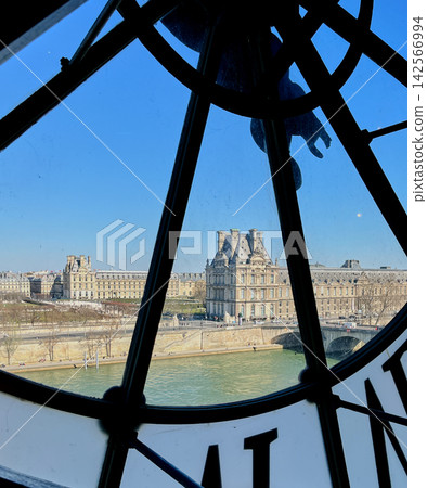 Iconic giant clock inside Musee d Orsay in Paris with Roman numerals and a view of the city through the transparent clock face Iconic giant clock inside Musee d Orsay in Paris with Roman numerals and a view of the city through the transparent clock face 142566994