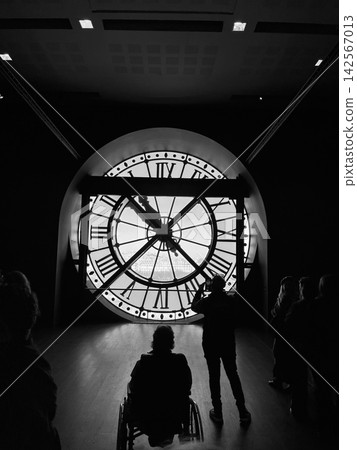 Iconic giant clock inside Musee d Orsay in Paris with Roman numerals and a view of the city through the transparent clock face Iconic giant clock inside Musee d Orsay in Paris with Roman numerals and a view of the city through the transparent clock face 142567013