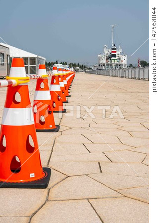 Perforated cones lined up at the harbor Perforated cones lined up at the harbor 142568044