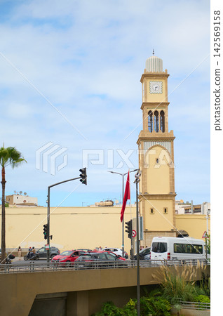 Casablanca clock tower and Art Deco architecture beside busy city street in Morocco Casablanca clock tower and Art Deco architecture beside busy city street in Morocco 142569158