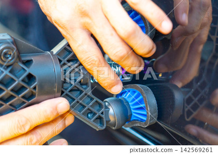 Removing dents on the car. PDR technology. Car body repair without painting. Removing dents on the car. PDR technology. Car body repair without painting. 142569261