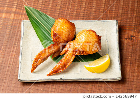 Chicken wing dumplings: Juicy chicken wings filled with various ingredients. Chicken wing dumplings: Juicy chicken wings filled with various ingredients. 142569947