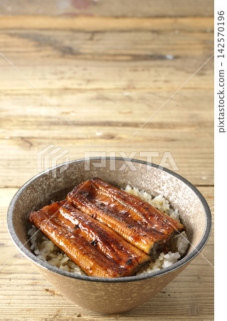 Photo of a single serving of unadon (eel rice bowl). Photo of a single serving of unadon (eel rice bowl). 142570196