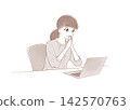 A woman grinning while looking at her laptop (sepia tone) 142570763