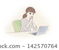 A woman grinning while looking at her laptop (natural) 142570764