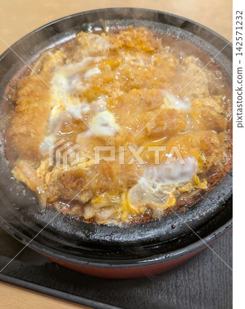 Katsushika Ward, Tokyo: Traditional, piping hot katsu-ni (simmered pork cutlet). Katsushika Ward, Tokyo: Traditional, piping hot katsu-ni (simmered pork cutlet). 142571232
