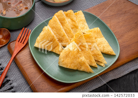 traditional Chinese Breakfast Fried Dough Blanket Youbing, Golden Crispy Flatbread Cruller traditional Chinese Breakfast Fried Dough Blanket Youbing, Golden Crispy Flatbread Cruller 142572033