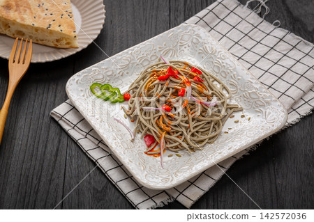 chinese cold tossed black soybean tofu shreds salad with chili oil and onion, traditional spicy Asian appetizer chinese cold tossed black soybean tofu shreds salad with chili oil and onion, traditional spicy Asian appetizer 142572036