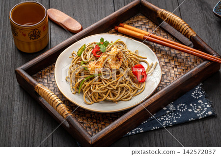 chinese cold tossed black soybean tofu shreds salad with chili oil and onion, traditional spicy Asian appetizer chinese cold tossed black soybean tofu shreds salad with chili oil and onion, traditional spicy Asian appetizer 142572037