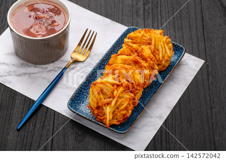 deep fried crispy shredded potato cakes a popular Chinese dim sum snack deep fried crispy shredded potato cakes a popular Chinese dim sum snack 142572042