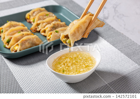 lean Pork and Corn Potstickers, Crispy Chinese Pan-Fried Dumplings lean Pork and Corn Potstickers, Crispy Chinese Pan-Fried Dumplings 142572101