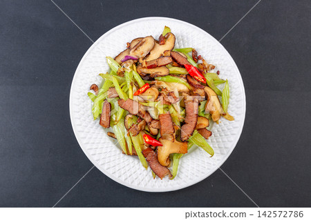 stir-fried celery and shiitake mushrooms with traditional chinese cured pork stir-fried celery and shiitake mushrooms with traditional chinese cured pork 142572786