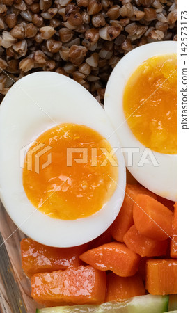 Healthy meal prep eggs buckwheat vegetables 142573173