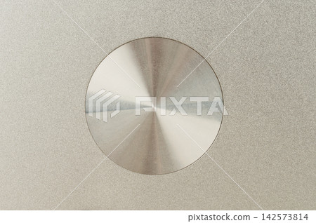 Grey shiny metal with brushed circle  surface 142573814