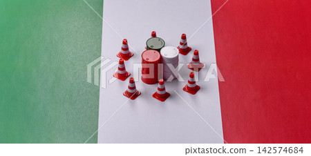 Metal barrels of oil, gas, or chemicals bearing on the flag of Italy and a ban sign, embargo Metal barrels of oil, gas, or chemicals bearing on the flag of Italy and a ban sign, embargo 142574684