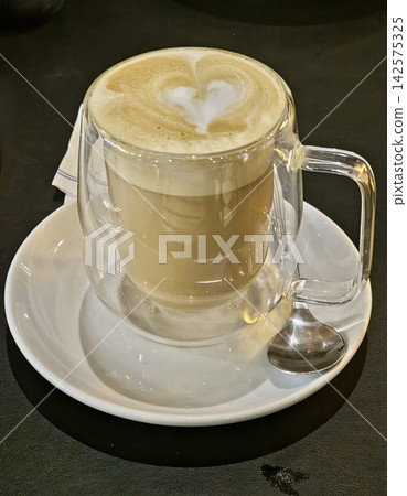 Latte Coffee with Heart Latte Art in Clear Glass Cup Latte Coffee with Heart Latte Art in Clear Glass Cup 142575325