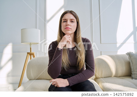 Web cam view of young woman talking looking in camera, online meeting, video call 142575892