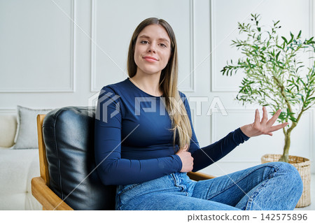 Web cam view of young woman talking looking in camera, online meeting, video call Web cam view of young woman talking looking in camera, online meeting, video call 142575896