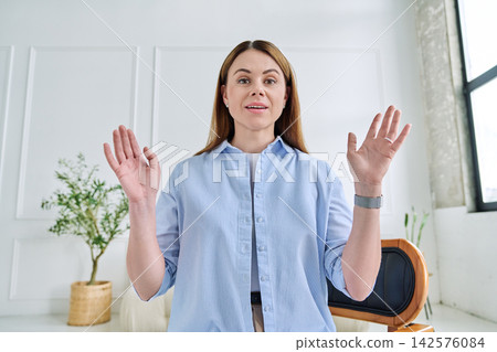 Young woman during a video call. Virtual Connection concept Young woman during a video call. Virtual Connection concept 142576084