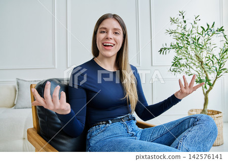 Web cam view of young woman talking looking in camera, online meeting, video call 142576141
