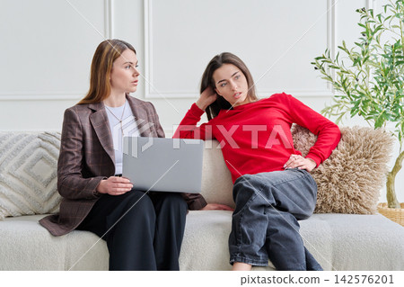 Teenage girl patient in therapy session with social mental therapist Teenage girl patient in therapy session with social mental therapist 142576201