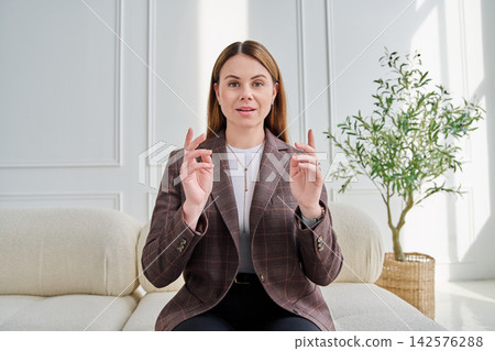 Webcam view woman entrepreneur, teacher, blogger working remotely in home office Webcam view woman entrepreneur, teacher, blogger working remotely in home office 142576288