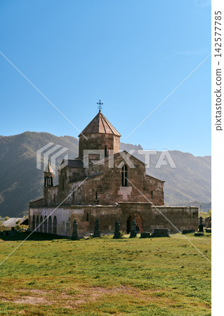 Exterior view of Odzun Church and Caucasus mountains, Lori Province, Armenia Exterior view of Odzun Church and Caucasus mountains, Lori Province, Armenia 142577785