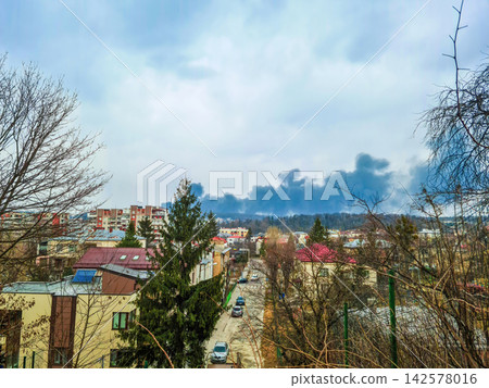 Smoke plume rising over city after military attack in Lviv, Ukraine Smoke plume rising over city after military attack in Lviv, Ukraine 142578016