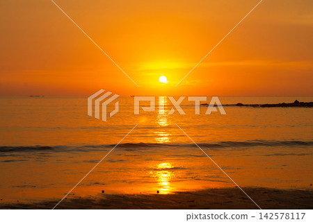 Beautiful Sunset Over the Sea with Waves, Summer Vacation and Relaxing Evening Mood. Beautiful Sunset Over the Sea with Waves, Summer Vacation and Relaxing Evening Mood. 142578117