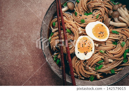 buckwheat noodles, soba, with shimeji mushrooms, boiled egg, green onion, sesame seeds, homemade, no people, 142579015