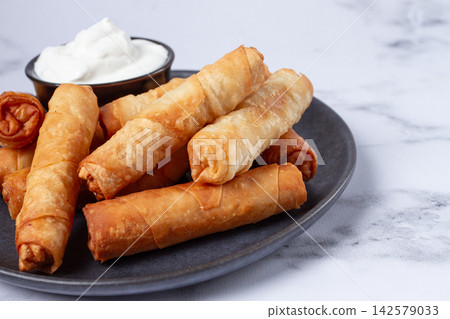 fried spring rolls with cheese, on a plate, with cream sauce, no people, fried spring rolls with cheese, on a plate, with cream sauce, no people, 142579033