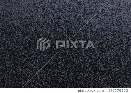 Texture background for text space showing grainy dark surface with soft patterns and uneven details that creates depth and contrast 142579230