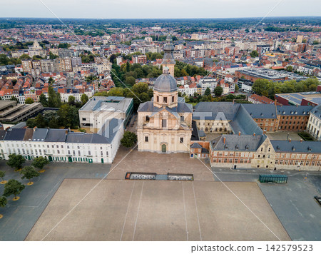 Aerial View of Saint Peters Abbey in Ghent. Aerial drone view of Saint Peter Abbey (Sint-Pietersabdij) and its large square with the baroque church dome in the historic city of Ghent, Belgium at golde Aerial View of Saint Peters Abbey in Ghent. Aerial drone view of Saint Peter Abbey (Sint-Pietersabdij) and its large square with the baroque church dome in the historic city of Ghent, Belgium at golde 142579523