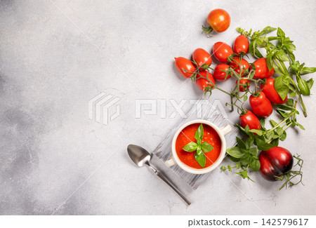 Fresh tomato basil soup in white bowl Fresh tomato basil soup in white bowl 142579617
