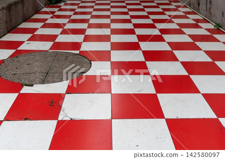 Red and white checkered floor in urban setting Red and white checkered floor in urban setting 142580097