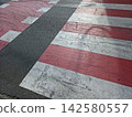 Vibrant Road Markings Create a Striking Scene in a Bustling Urban Area 142580557
