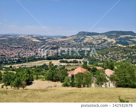 Village landscape panoramic view, in rural countryside with hills and mountains in the, with houses, fields, trees, river, from a high vantage point overlooking the village perspective. Village landscape panoramic view, in rural countryside with hills and mountains in the, with houses, fields, trees, river, from a high vantage point overlooking the village perspective. 142582676