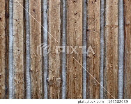 straight wooden fence with metal strips in an outdoor setting, neutral and clean background for copy space and design resources, modern and warm tones, architectural and design. 142582689