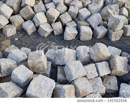 Gray cubic stones pile for construction and landscaping use crushed square blocks for pathways borders edging garden drainage and outdoor design applications, with gray, stone, rock, cobble detail Gray cubic stones pile for construction and landscaping use crushed square blocks for pathways borders edging garden drainage and outdoor design applications, with gray, stone, rock, cobble detail 142582836