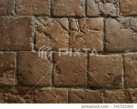 Weathered red brick wall texture with rough chipped mortar, warm rust beige tones, worn masonry surface, natural patina, cracks, grit, and detailed aging for background use Weathered red brick wall texture with rough chipped mortar, warm rust beige tones, worn masonry surface, natural patina, cracks, grit, and detailed aging for background use 142582862