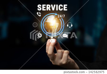 Person Holding Light Bulb with Service Icons Illustrating 24 7 Availability and Innovative Solutions to Customer Needs Fluxor Person Holding Light Bulb with Service Icons Illustrating 24 7 Availability and Innovative Solutions to Customer Needs Fluxor 142582975