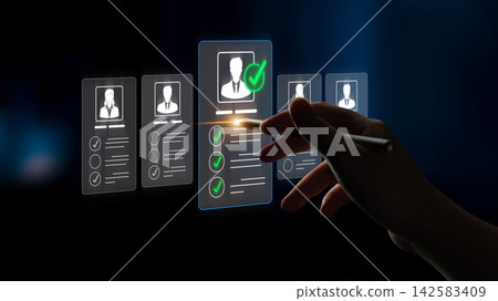 A hand interacts with a virtual interface displaying candidate profiles. This image represents the modern recruitment process emphasizing selection and decision-making in hiring. Sigmoid A hand interacts with a virtual interface displaying candidate profiles. This image represents the modern recruitment process emphasizing selection and decision-making in hiring. Sigmoid 142583409