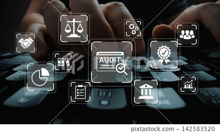 Hands on Keyboard with Overlay of Audit Icons and Business Symbols Representing Financial Compliance and Analysis in a Professional Environment Gluon Hands on Keyboard with Overlay of Audit Icons and Business Symbols Representing Financial Compliance and Analysis in a Professional Environment Gluon 142583520