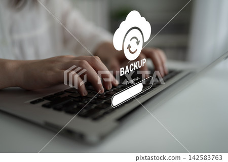 Hands Typing on Laptop Keyboard with Cloud Backup Icon and Progress Indicator for Data Storage and Protection Concepts in Modern Technology Ledger 142583763